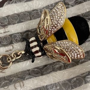 Metal bag charm/keychain by Henri Bendel